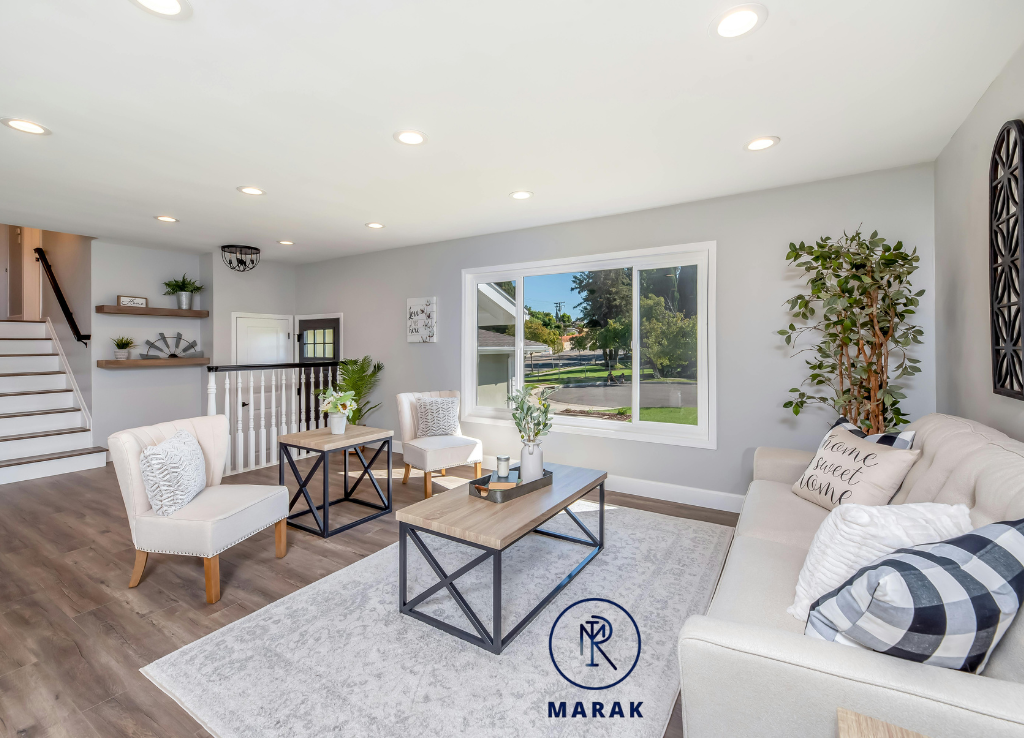 A living room designed by one of the best interior designers, showcasing natural light and minimal design.