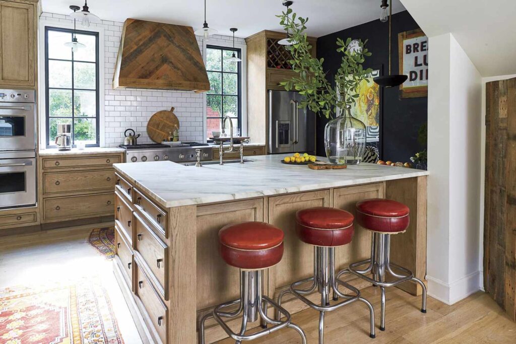 Peninsula kitchen with cozy breakfast counter and wooden finish.