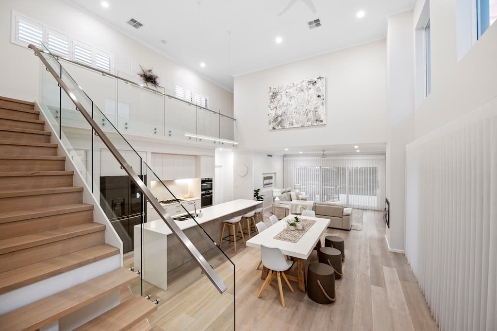 Open kitchen seamlessly merging with dining and living area.