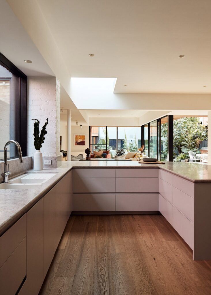 U-shaped layout image with sink, hob, and fridge on different arms of the “U”