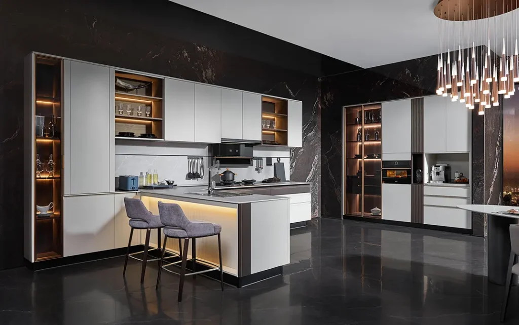 Luxury kitchen with chandelier lighting, wine rack, and built-in appliances.